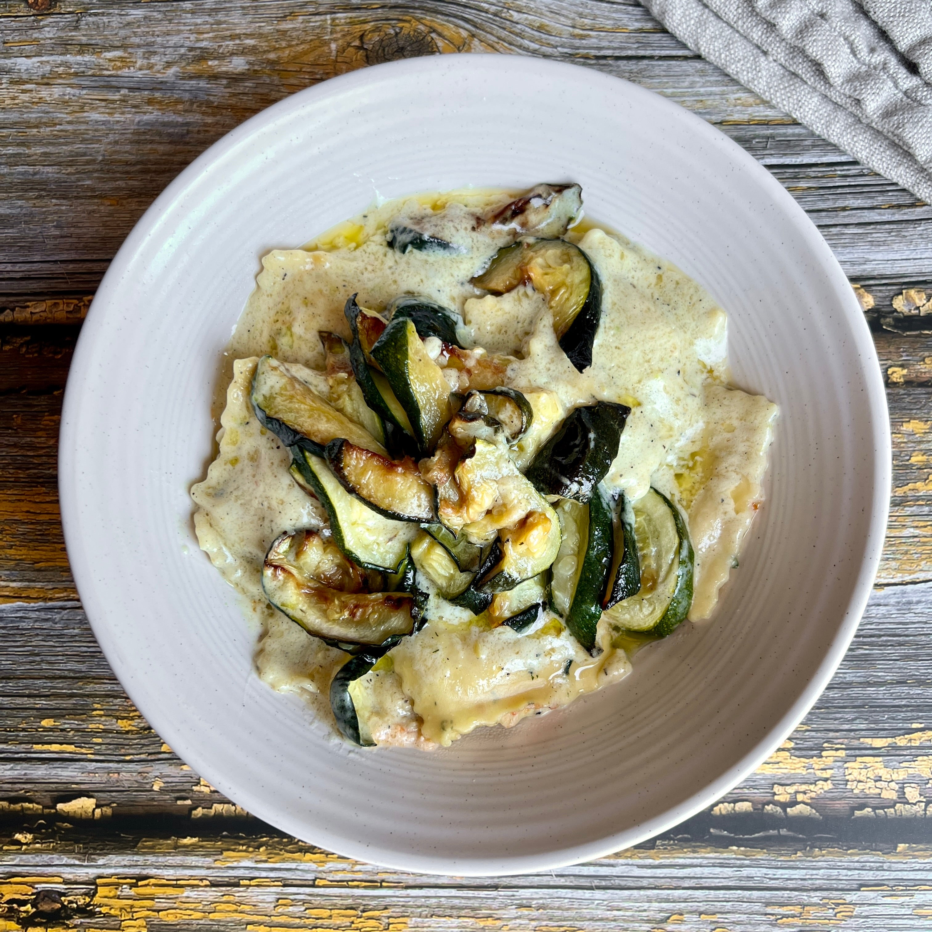 Spinach Ravioli with Jalapeño Cream Sauce and Zucchini