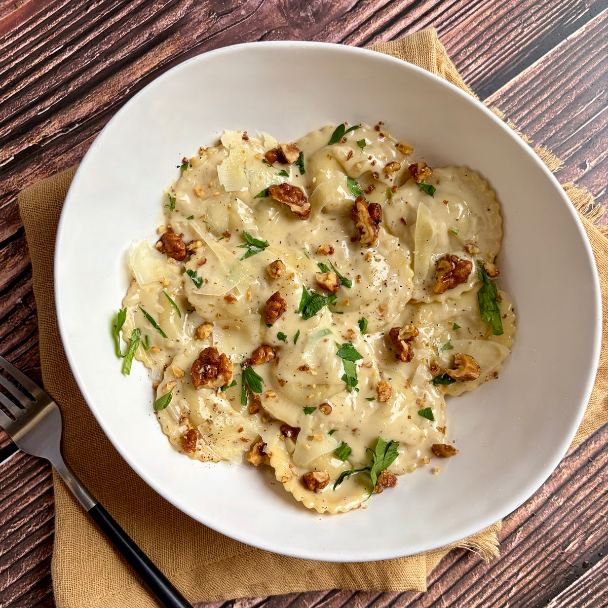 Pear-Chèvre Ravioli with Sherry Cream and Balsamic Glazed Walnuts